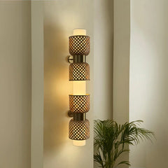 Decorative wall sconce combining natural bamboo texture, brass finish and LED lighting.