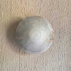 Front View of Alabaster Wall Sconce light on wall
