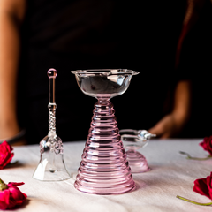 Tall Glass Diya in pink with glass bell and short diya, perfect for pooja spaces and elegant home interiors.
