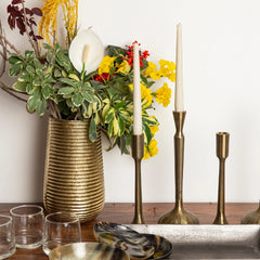 Three brass plated Sanee Candle Holders with a solid pattern.