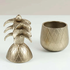 Decorative Bronze pineapple-shaped Votive on a light background