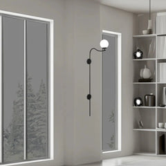 Modern interior design with a wall-mounted mirror Glamour Arch Wall Lamp and decorative items on shelves.