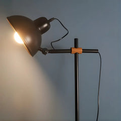 Unique scandinavian black floor lamp dome shape light shown from a side angle