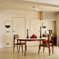 Trilogy Wall Sconce  in a Dining room with wooden table and chairs, apples on the table.