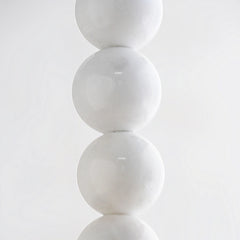 Closer view of Black Drop Pendant Lamp showing white spherical objects stacked