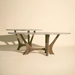 Maya tables made of marble with unique base design on a beige background