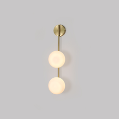 singular arm link wall sconce for a streamlined visual effect