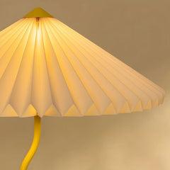 Close view of Yellow floor lamp with a pleated shade