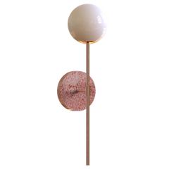 A wall sconce featuring a white glass globe light fixture mounted on a terrazzo base plate.