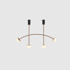 A rose gold multi-light chandelier with a curved structure.