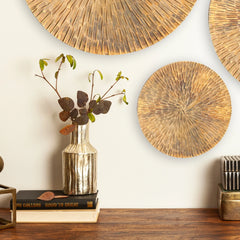 Decorative Cano Vase with a textured finish in a conical shape, placed on a table with dried flowers