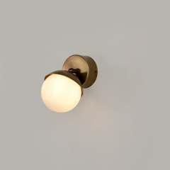Fly Wall Sconce Small ambient lighting effect on white wall with compact depth & sleek contemporary design.