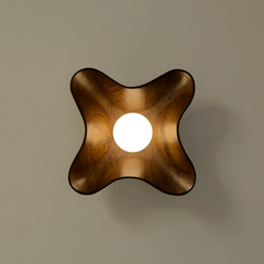 Detailed view of Compass Wall Light hardware and handcrafted finish