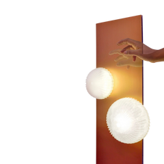 Detail shot of the Arc floor lamp's base and aluminium construction
