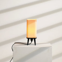 Small decorative dawn table lamp with warm lighting for ribbed shade and black stand
