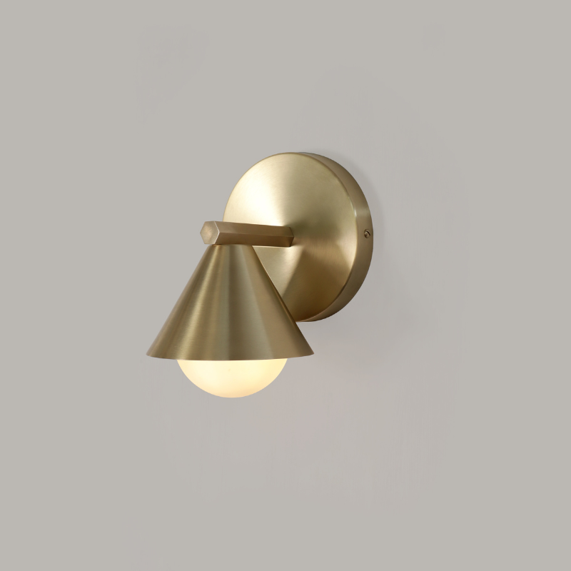 Detail shot of Cone Wall Sconce- aged brass variant finish texture