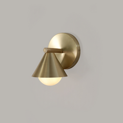 Detail shot of Cone Wall Sconce- aged brass variant finish texture