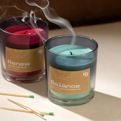Scented Peppermint Vegan Wax Candle named "Balance" placed next to "Renew" scented candle 