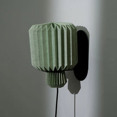 Lumi Fold wall light with European linen shade in minimalist bedroom
