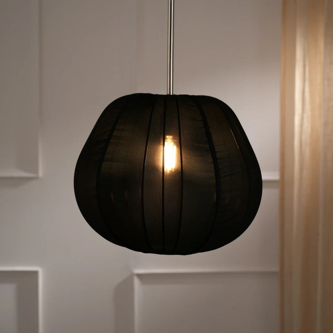 A Berlin Georgette Pendant Lamp with a soft white fabric shade, hanging from a ceiling mount.