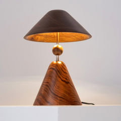 Decorative Nuit Table Lamp with a wood shade and base , casting warm light