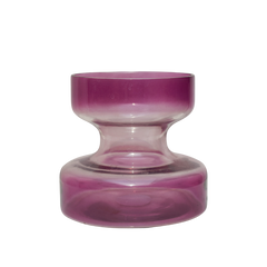 A tall lilac colored glass vase with a retro shape, displayed with a smaller vase of the same color in the background, both containing pink flowers.