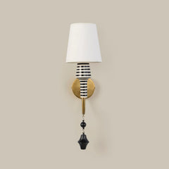 Decorative Stripe Wall Light with fabric shade, ceramic stem having graphic black-and-white striping and a brass arm 