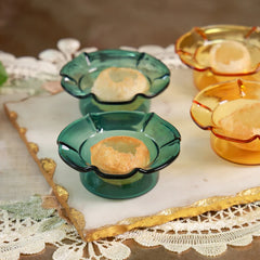 PETAL - Mini Glass Server – close-up of teal and yellow petal servers holding puris on a gold-edged marble board
