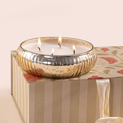 Illume - Lid Jar & Bowl Candle - Venetian Bergamot - Set of 2, lit multi-wick champagne glass bowl on gift box, angled view
