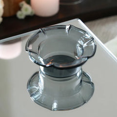 PETAL - Mini Glass Server in clear black – smoky borosilicate glass with petal rim reflected on a mirror