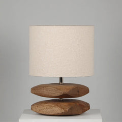 Sabbia Table Lamp with wooden base and beige fabric shade on a gray background