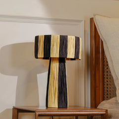 Decorative Wald Table Lamp with black and gold stripes on a wooden table.
