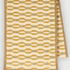 Poppy Ochre Table Runner close-up of ochre and blue embroidery on cotton slub