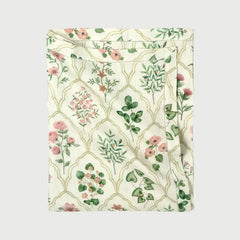 Eden Rose Linen Table Cover folded, showing hand-painted floral ogee print