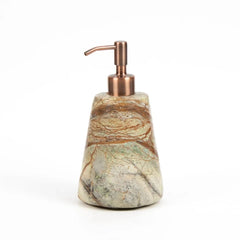 A decorative Reen soap dispenser with a tapered stone base featuring natural marbled patterns in beige, green, and brown, topped with a brushed copper pump dispenser.