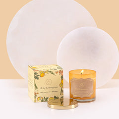 Illume Midi - Lid Jar Candle - Saffron - Wild Lemongrass - Set of 2, lit amber glass jar with gold lid beside Wild Lemongrass box