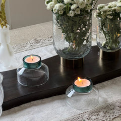 NIB - Mini Dessert Bowl - Set of 4 inverted as tealight holders – lit candles in teal bases on a dark wood tray