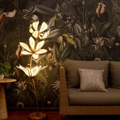 Decorative floor lamp with floral design, showing its warm ambient glow