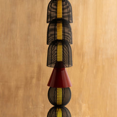 Totem Black Floor Lamp close-up detail of its woven MS baskets and bold red metal shade
