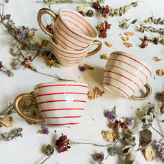 Waldo Cups set of 4 placed on a table along with dry flowers