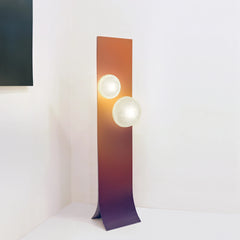 Designer floor lamp with gradient design shown at full height for scale
