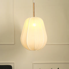 A white georgette pendant lamp hanging in a room, diffusing light and creating a warm glow.