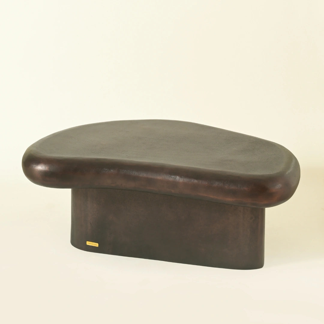 Brown color coffee table in curved design for ultra modern homes
