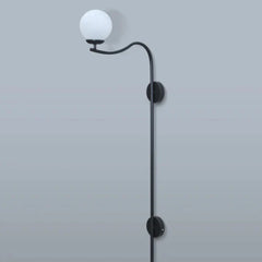 Black wall-mounted lamp with a curved arm on a light gray background
