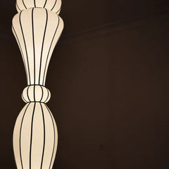 Close look of Decorative pendant lampshade with ribbed design on a dark background