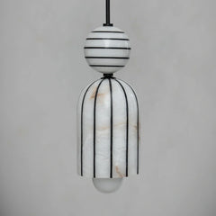 Modern pendant light with black and white striped design on a gray background