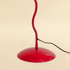 Red floor lamp with a curved neck and red base
