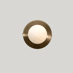 Dew Wall Sconce Small Glass Globe installed in a modern interior giving warm ambient light