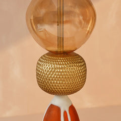 Premium glass floor lamp with amber glass shade and textured gold base