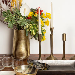 Unique design Bhrama Vase made of aluminum in gold finish and textured lines, placed with candles and candle stands